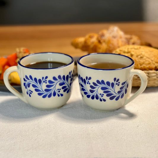 Ceramic mug set featuring blue patterns and sturdy handles for daily beverage use. hand painted and made in Mexico