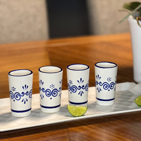 blue and white artisan ceramic shot glass set with unique hand-painted talavera designs, ideal for home bar decor.”