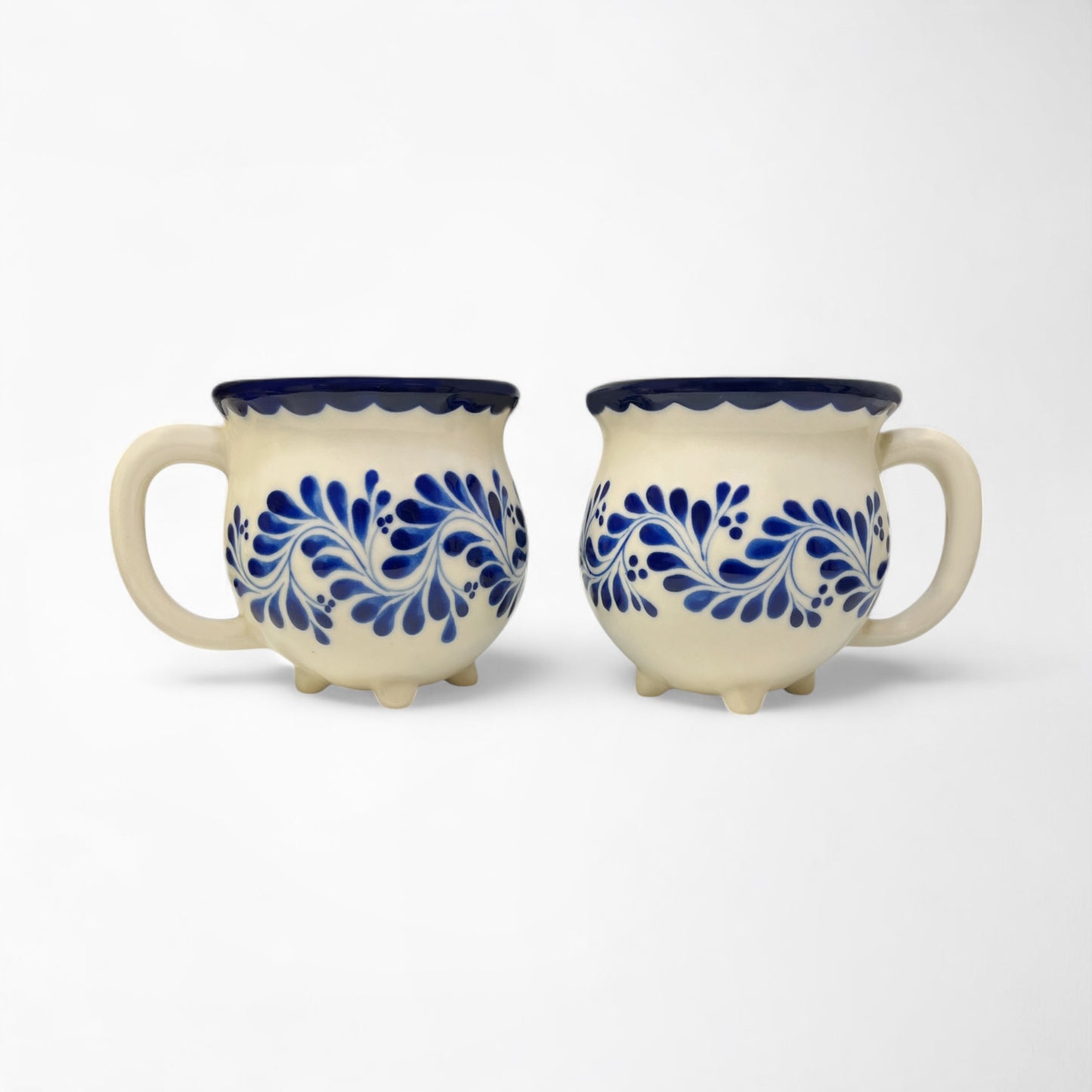 Hand-painted mug set ideal for gifting, featuring vibrant blue designs and smooth ceramic finish. Hand painted and made in Mexico