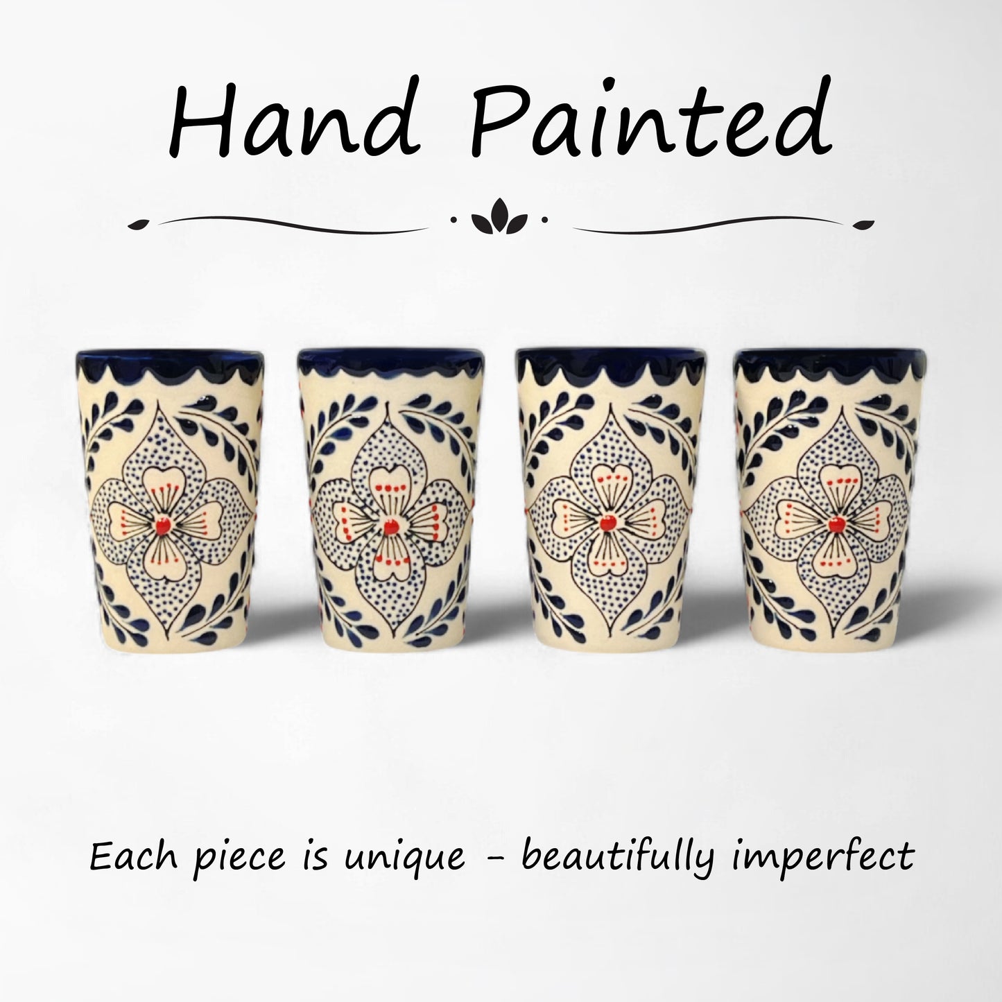 matching set of hand-painted ceramic shot glasses with intricate floral pattern