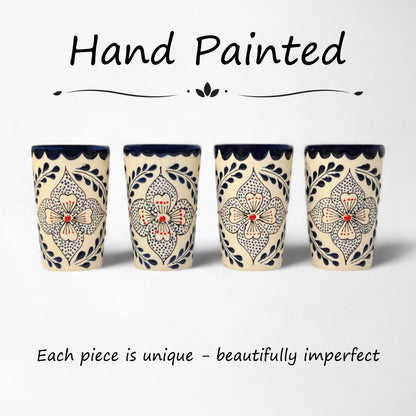 matching set of hand-painted ceramic shot glasses with intricate floral pattern