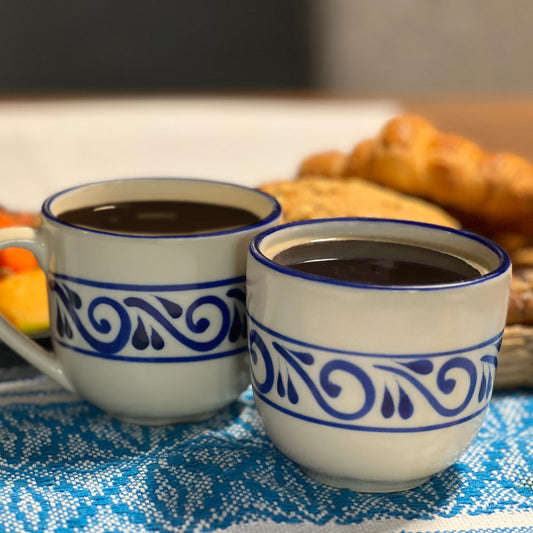 Two mugs with unique hand-painted talavera designs, combining functionality and artistic style. Made in Mexico