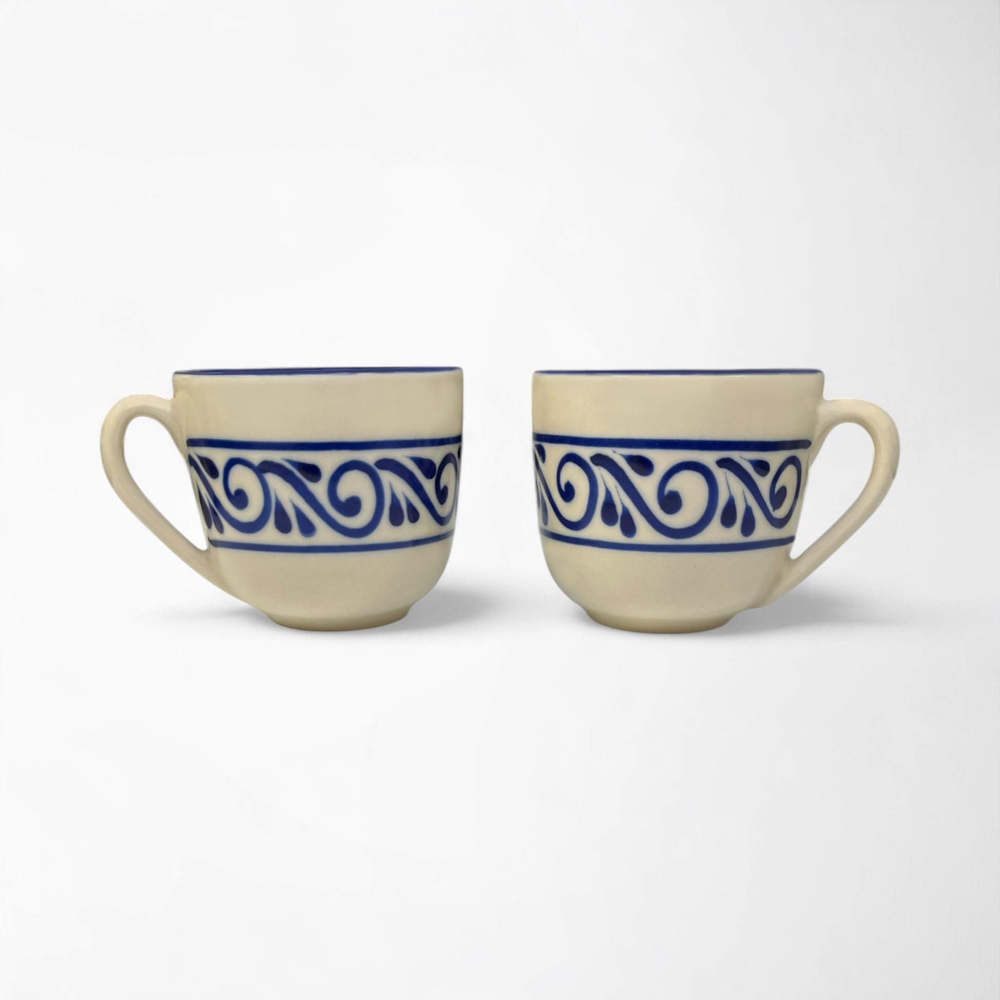 Set of ceramic mugs designed for daily coffee or tea rituals, combining comfort and beauty