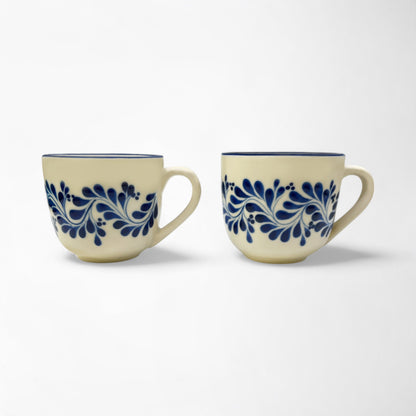 Set of two handcrafted ceramic mugs showcasing talavera designs, perfect for gifting or personal use.