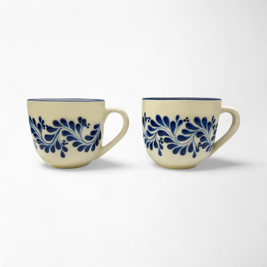 Set of two handcrafted ceramic mugs showcasing talavera designs, perfect for gifting or personal use.