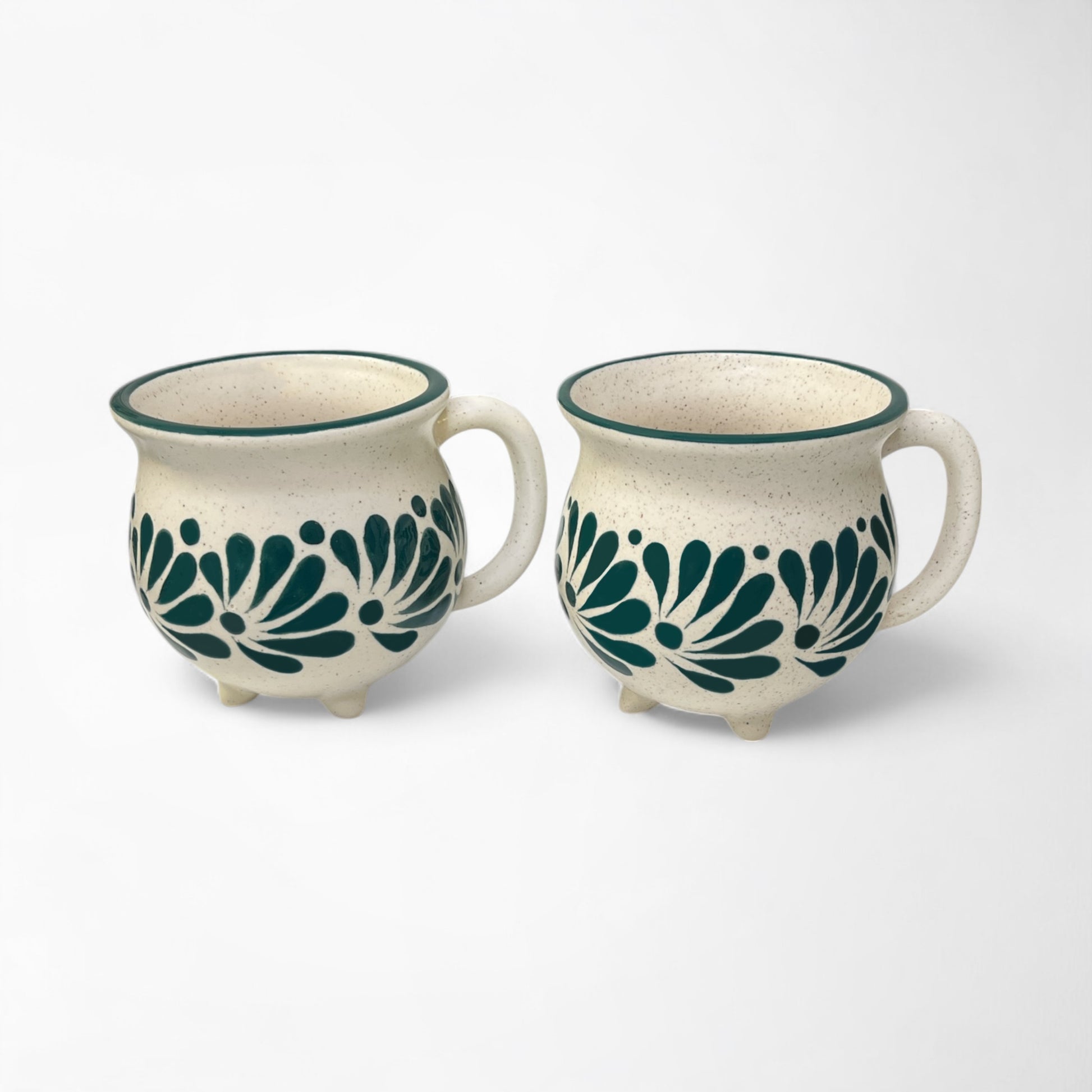 Set of hand-painted ceramic mugs combining unique artistry with everyday practicality.