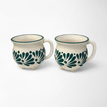 Set of hand-painted ceramic mugs combining unique artistry with everyday practicality.