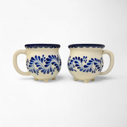 Hand-painted mug set ideal for gifting, featuring vibrant blue designs and smooth ceramic finish. Hand painted and made in Mexico