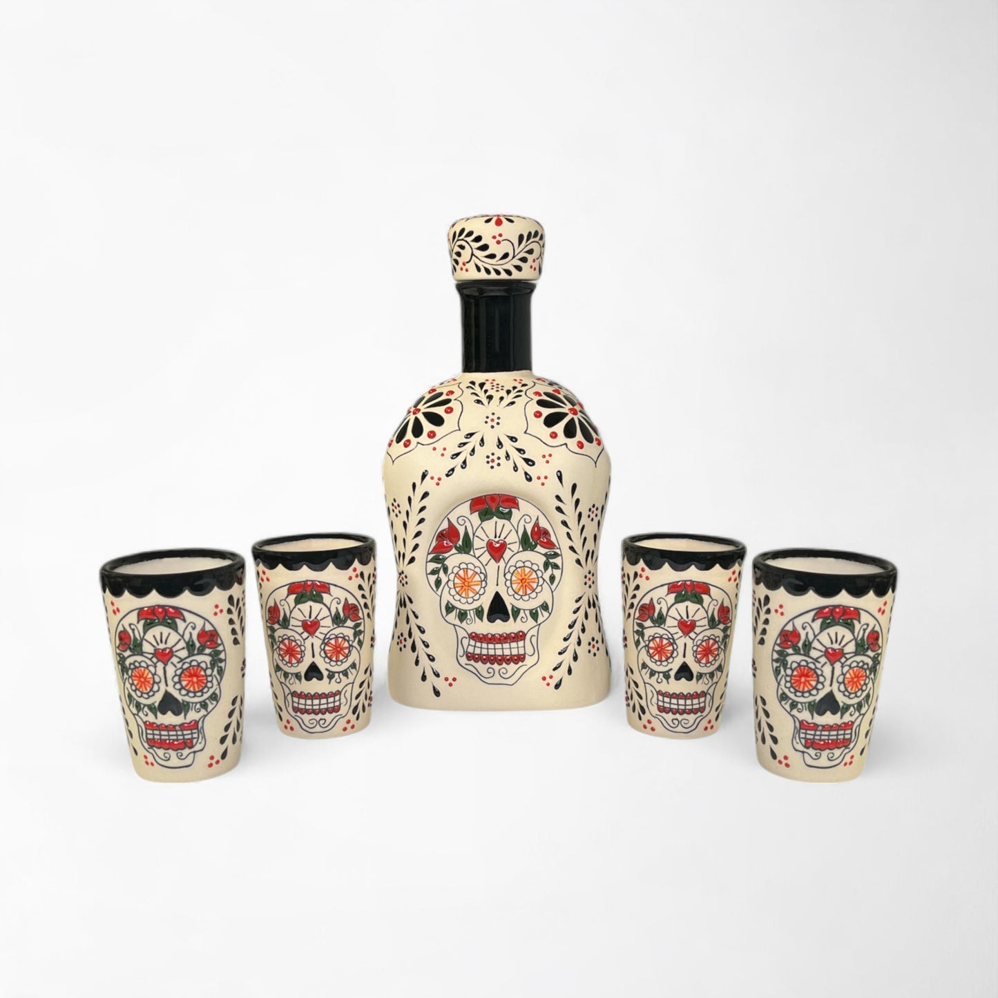Decorative tequila decanter and shot glasses with skull design. Talavera design. Handmade and painted