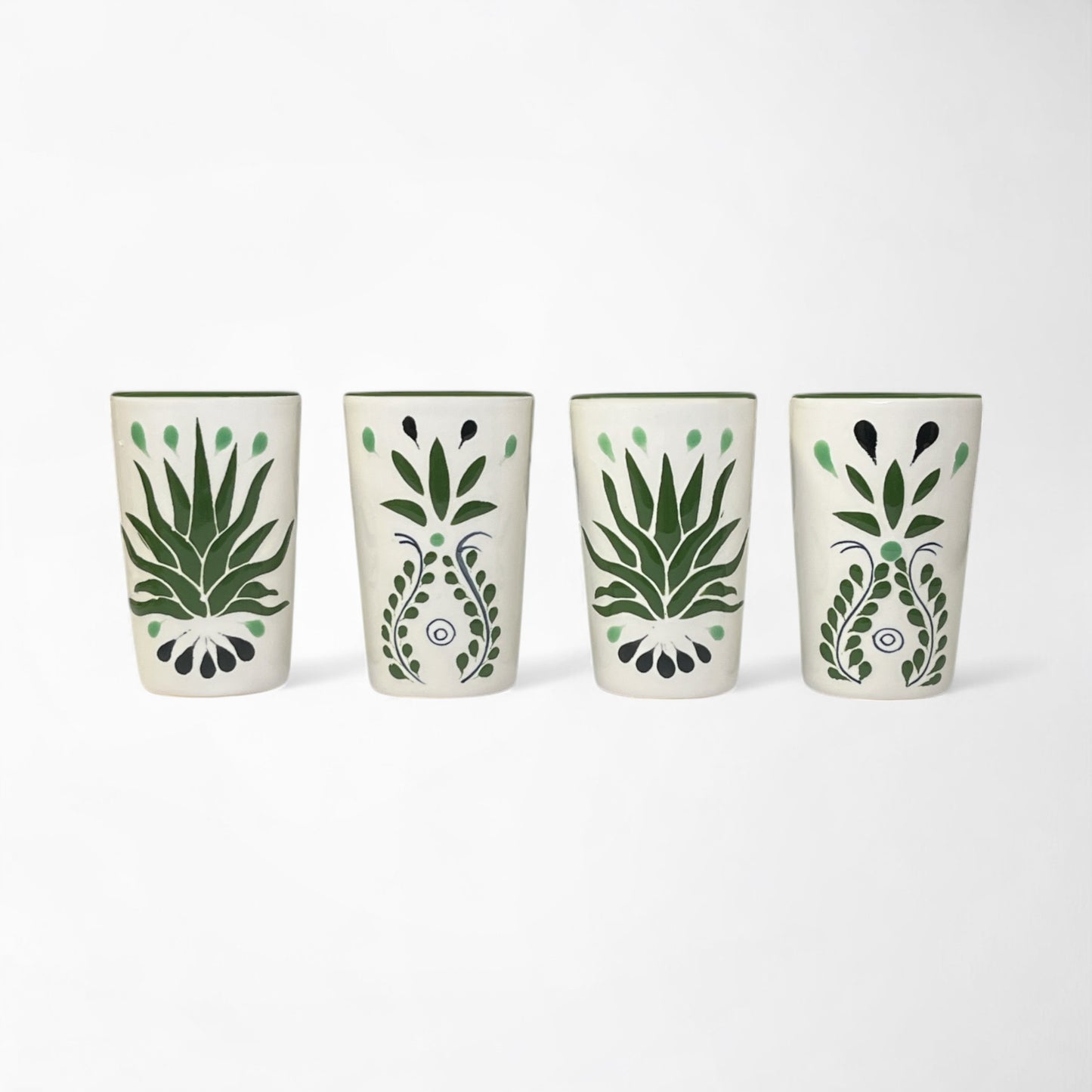 Artisan shot glasses with green agave design, handmade in traditional Talavera style