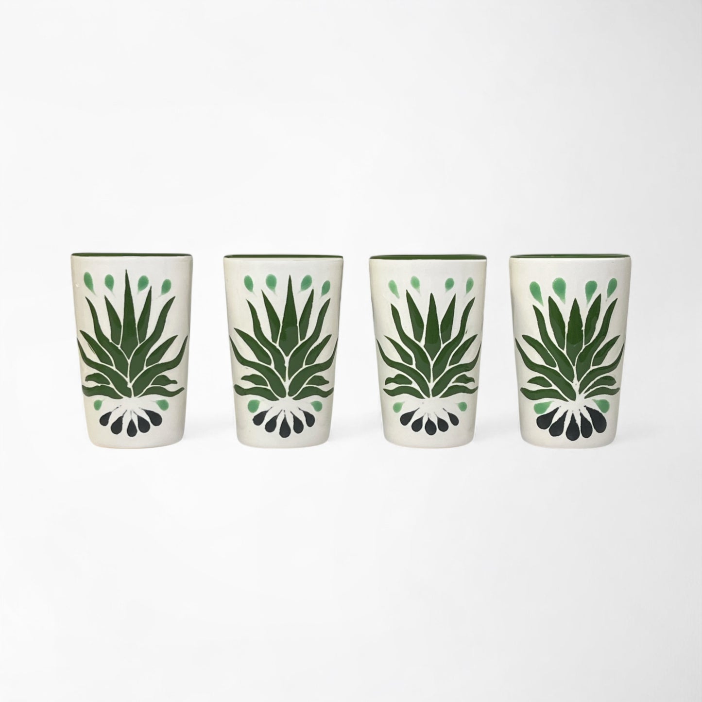Set of four hand-painted ceramic shot glasses featuring green agave design, perfect for tequila or mezcal