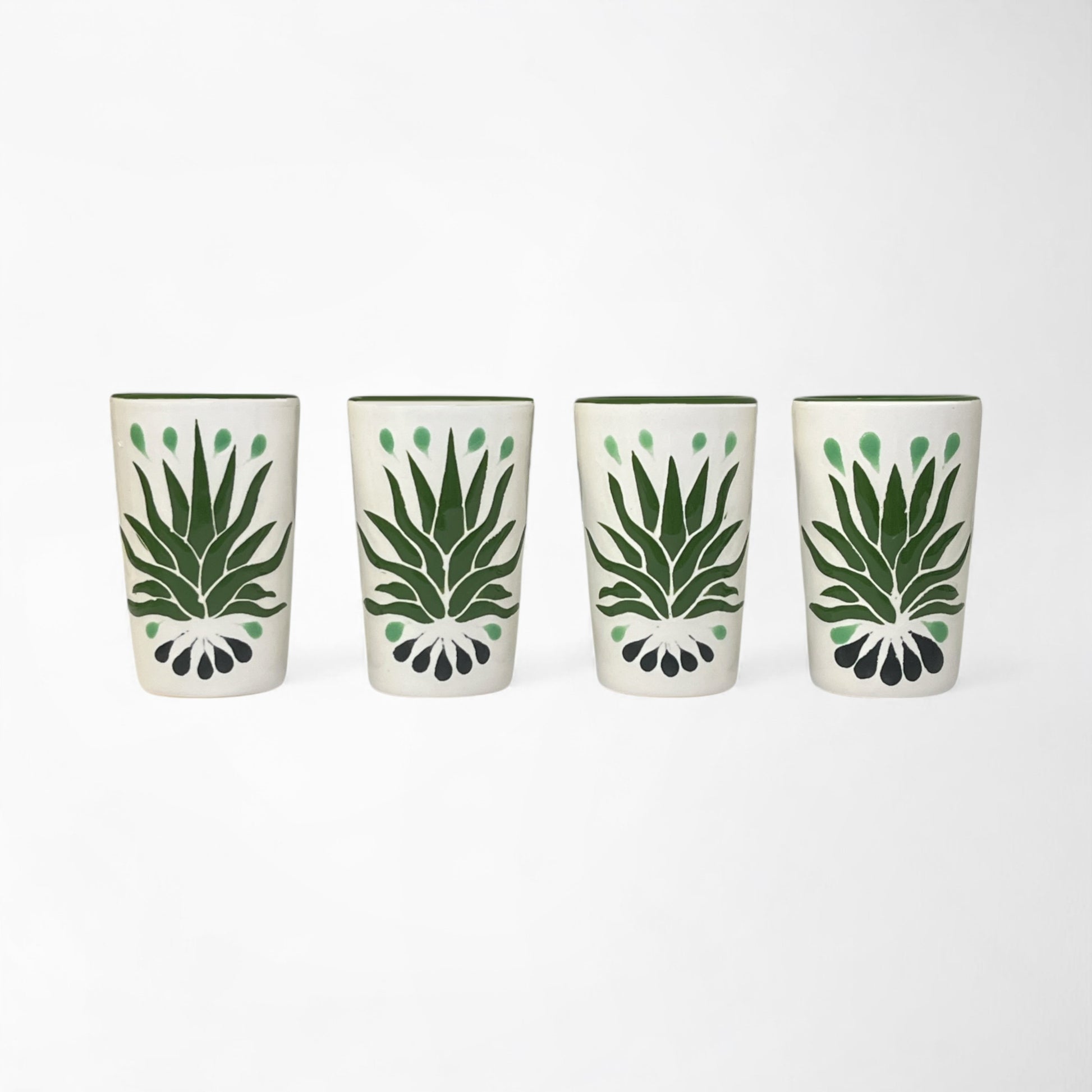 Set of four hand-painted ceramic shot glasses featuring green agave design, perfect for tequila or mezcal