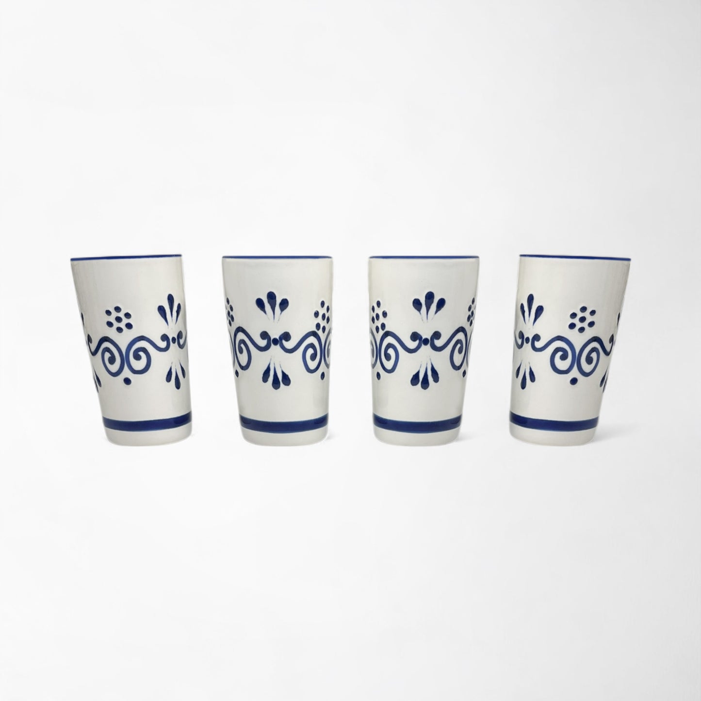 Four-piece hand-painted ceramic shot glass set, unique gift idea for friends and family. Made in Mexico